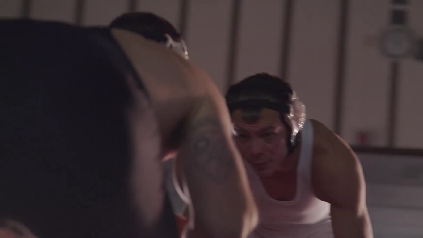 Two wrestlers are squaring off head to head