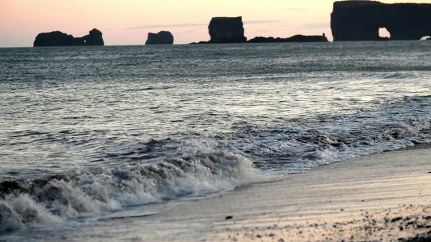Small waves crashing up on the shore