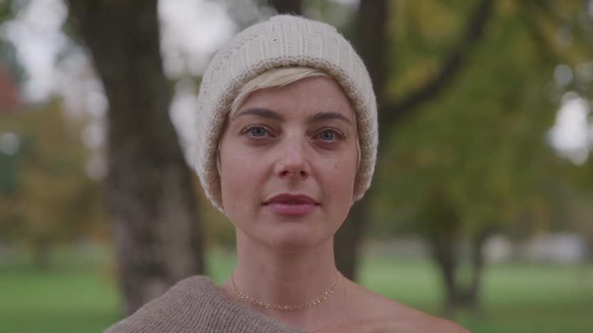 A woman slowly turns her head