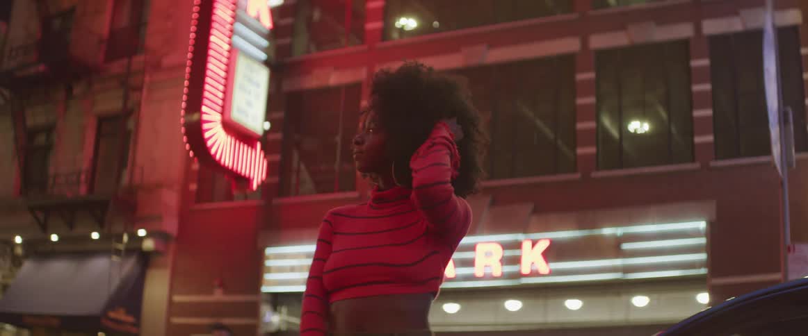 A woman looks around in the city
