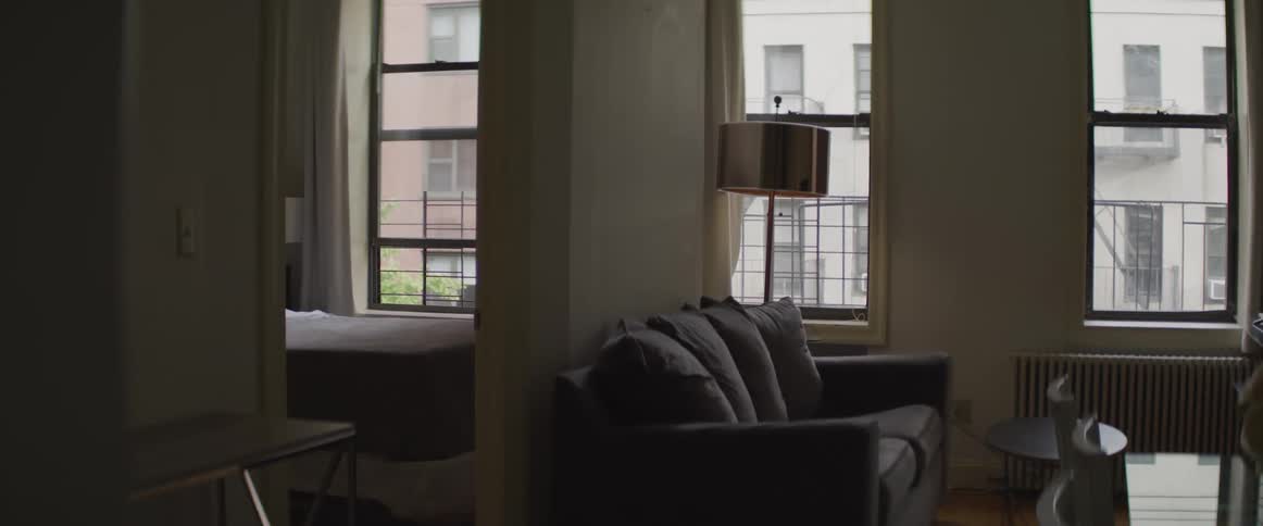 Furniture fills a small apartment in a city