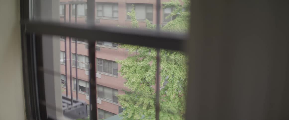 Apartment complexes out the window of an apartment building
