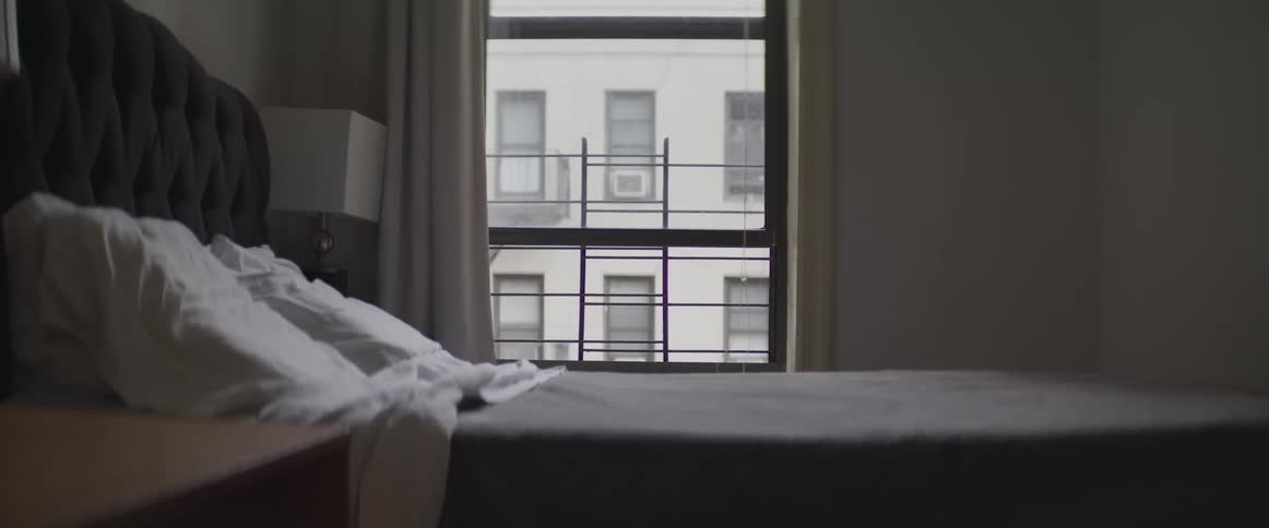 The bed is made in the room