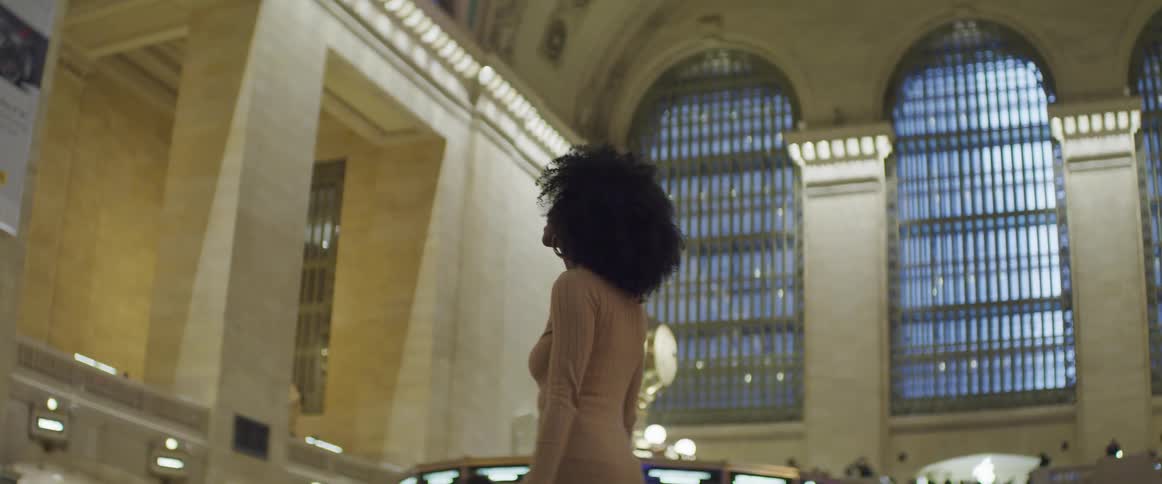 A woman admiring the interior of a large building