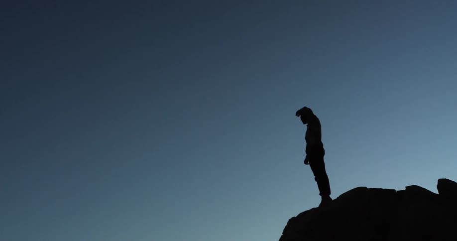 A person is gazing on the top of the mountain