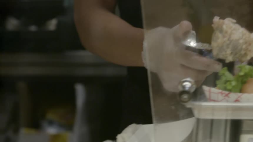 The person builds a sandwich