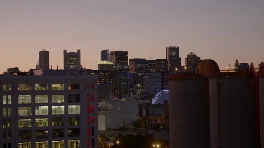 A city skyline with buildings and the sky in the background