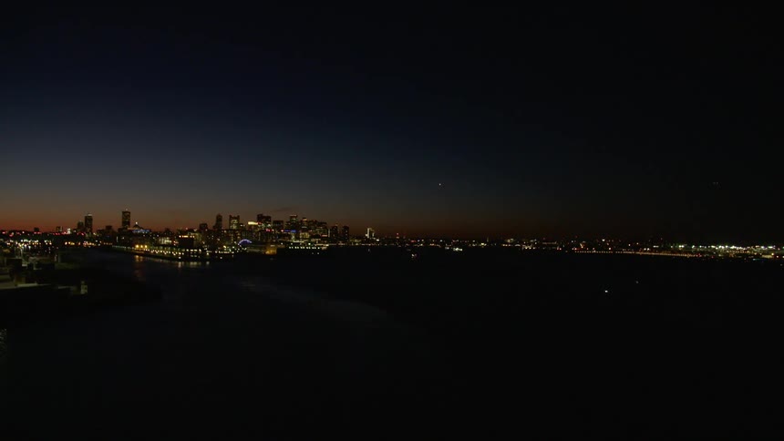 Aerial view of the distant city skyline at night