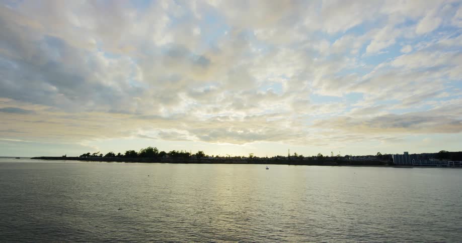 A lake with the coast in the background