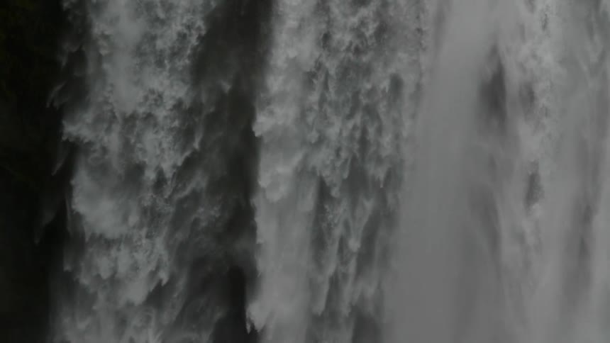 Water cascades over a cliff