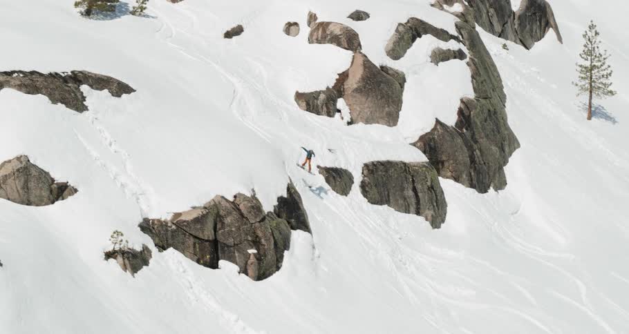 A person snowboarding down a snowy slope
