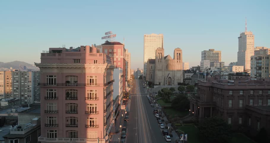 Aerial view of an empty street and a historical church at dawn