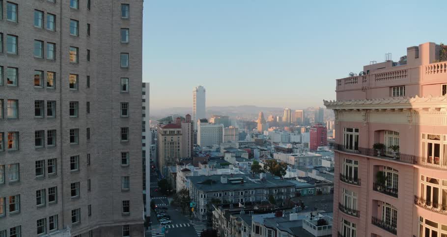 Aerial view of the apartments and long street in the late afternoon