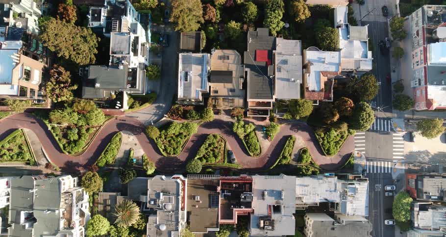 Birds eye view of houses and cars in a neighborhood