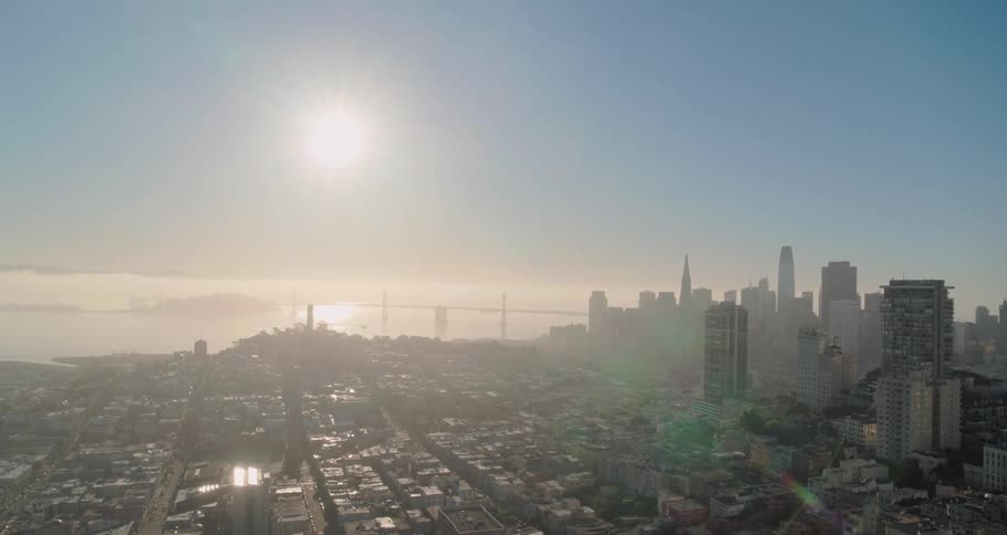 The city is covered with fog at sunrise