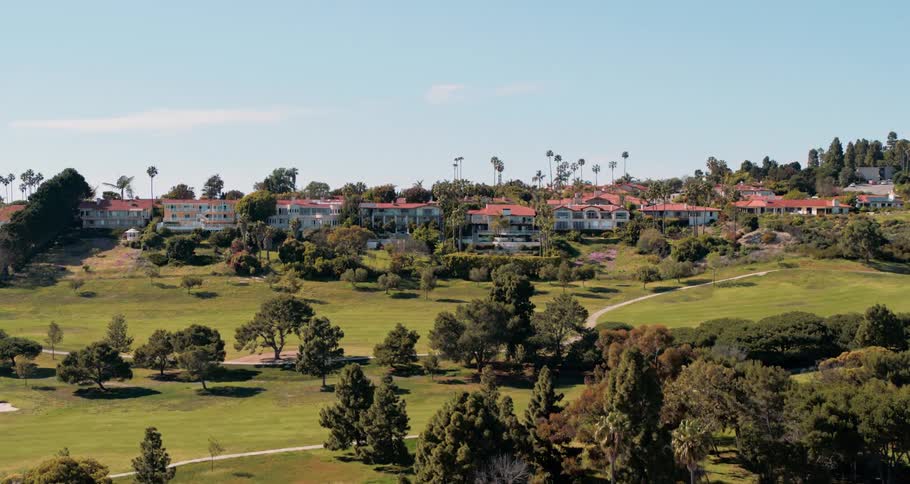 Many large homes and apartments line the hills