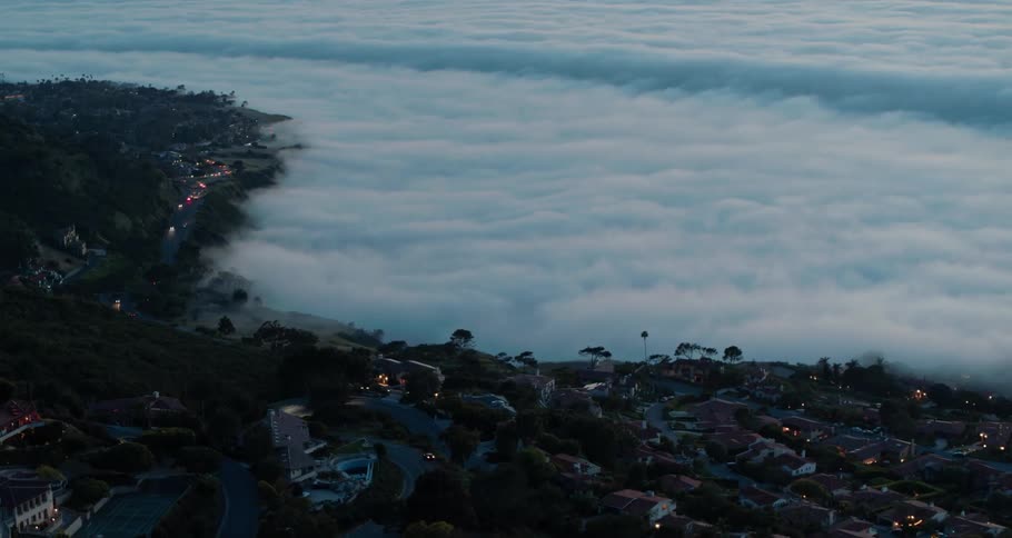 A coastal town with roads houses and vehicles