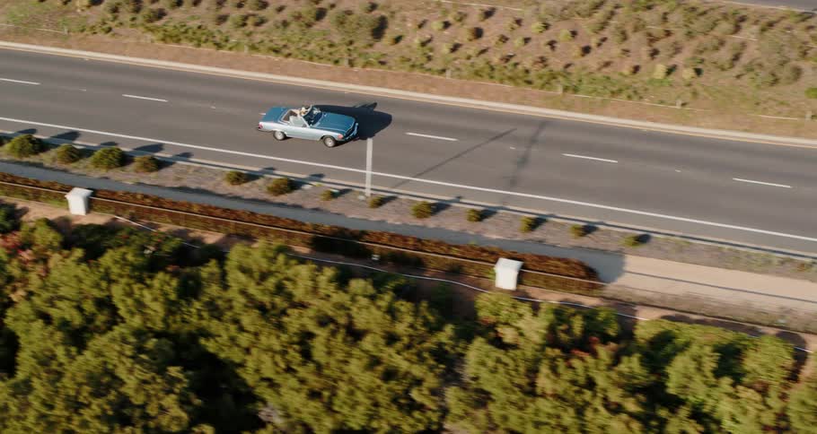 Only one car is driving on the road below