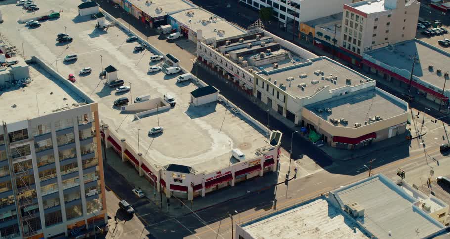 Apartment buildings and parking garages fill several blocks in a city