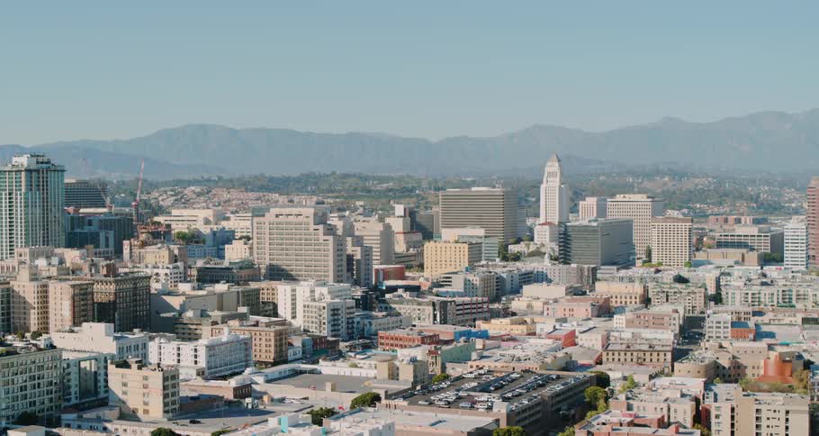 The mountains are past the large city