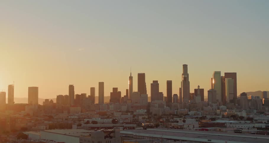 The sun is rising on the city