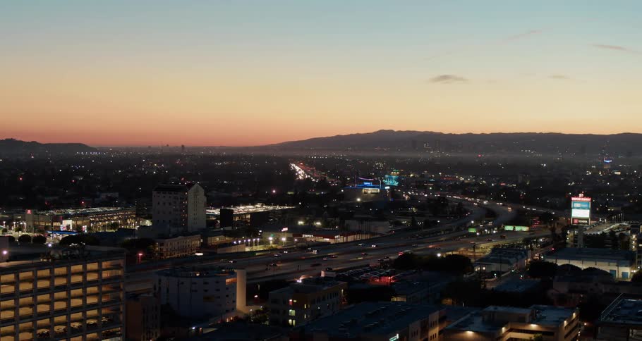 An aerial view of a downtown city is displayed