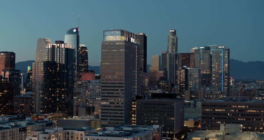 The building windows are lit at sunset