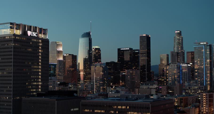 Aerial view of the illuminated high rise buildings at dusk
