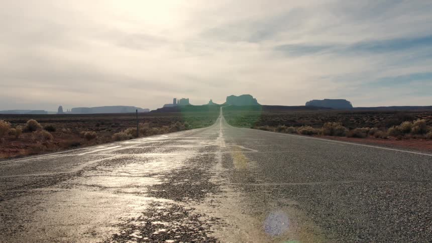 A road in the desert during an overcast day