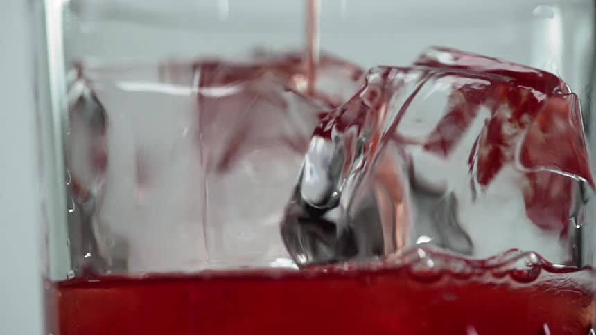 The drink is poured over the ice