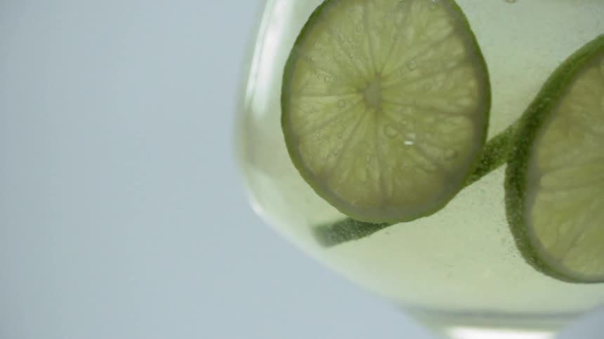 Limes in a glass of alcohol