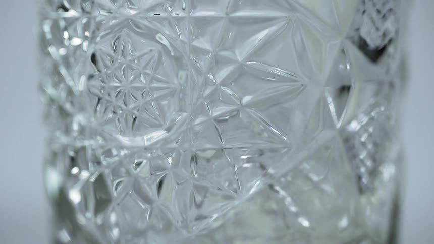 Liquid pours into a decorative glass