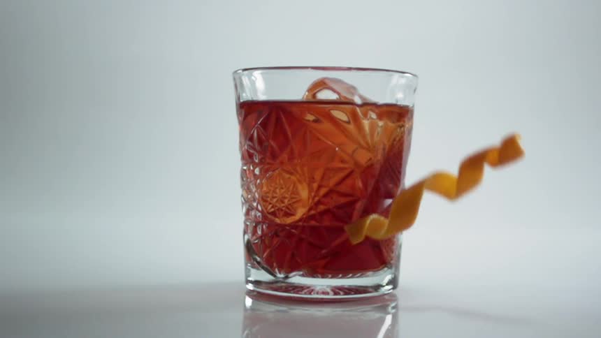 A glass filled with liquid is displayed