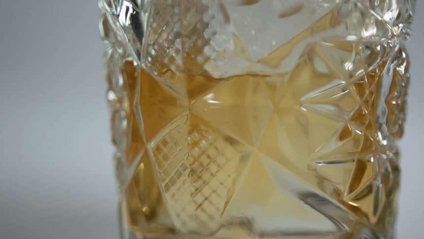 A drink being poured in a glass