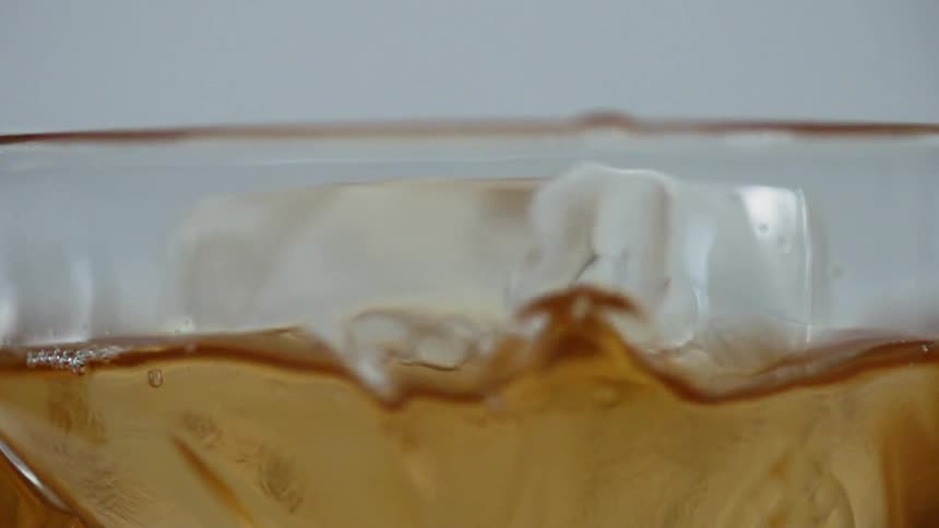 Cocktail drop falls into the glass