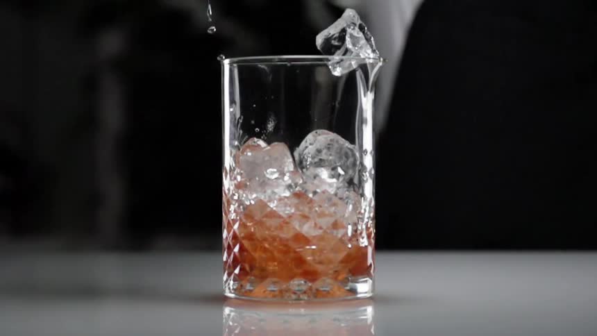 The ice is dumped into the glass