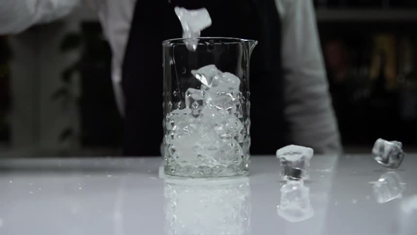 The ice is poured into the glass