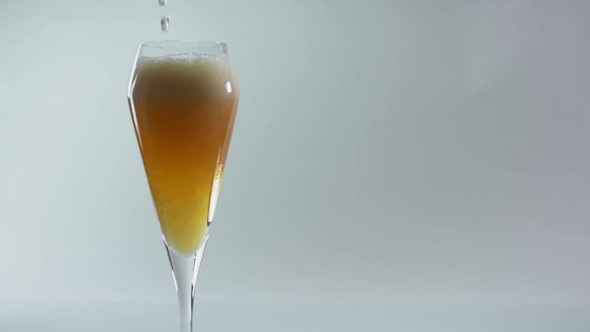 Alcohol being poured in to a glass