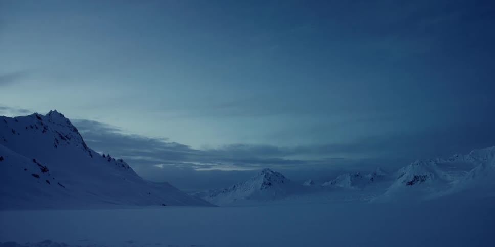 The sun rises near the mountains