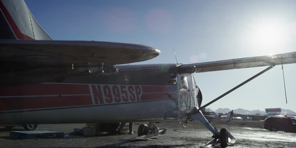 Pilot starts the light aircraft engine