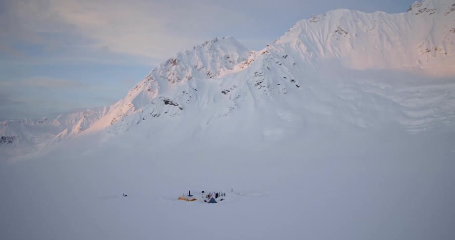 A camp in snow covered valley in the arctic