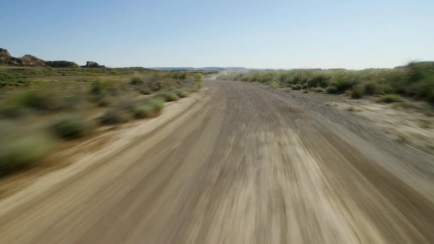 A gravel road in the arid countryside