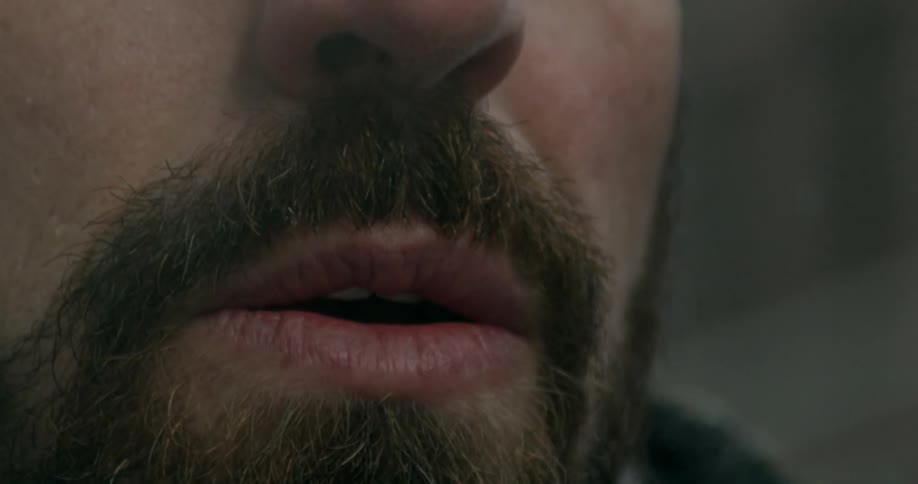 Close up of a man's lips and facial hair
