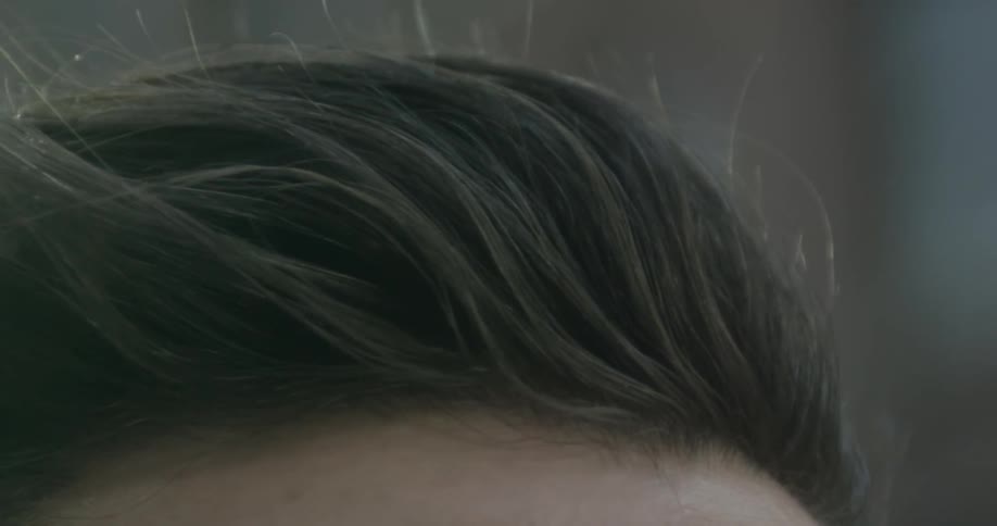 Someone's hair as is blows in the wind