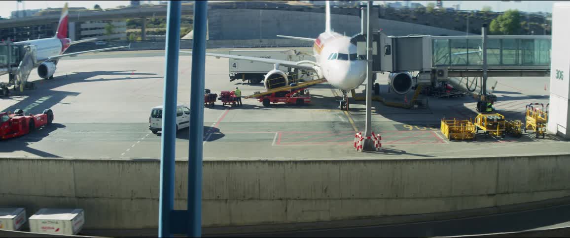 An airplane and cargo is displayed outdoors
