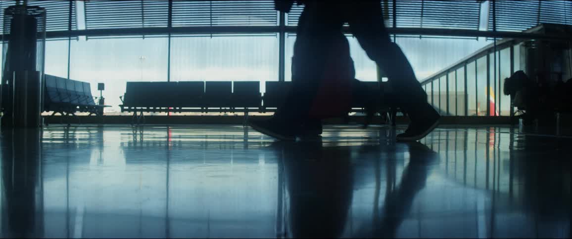 People walking through an airport