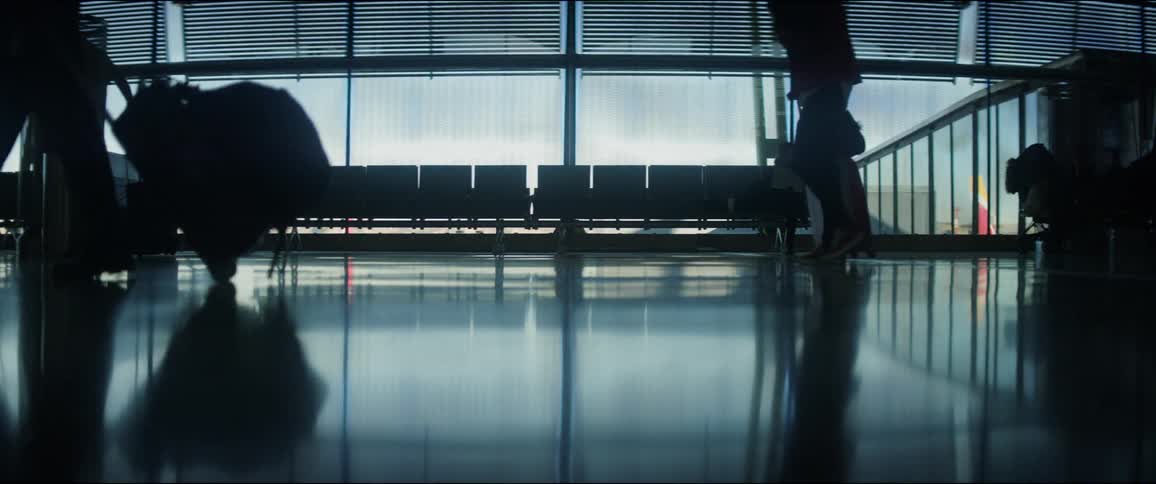 People walk through the airport