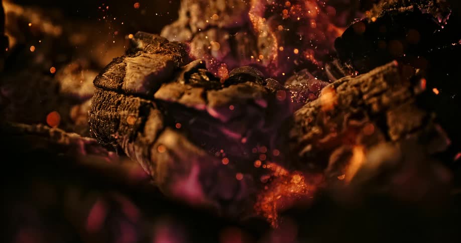 The wood burns in the fire
