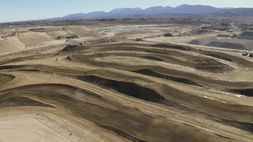 People riding motorbikes on a motocross track