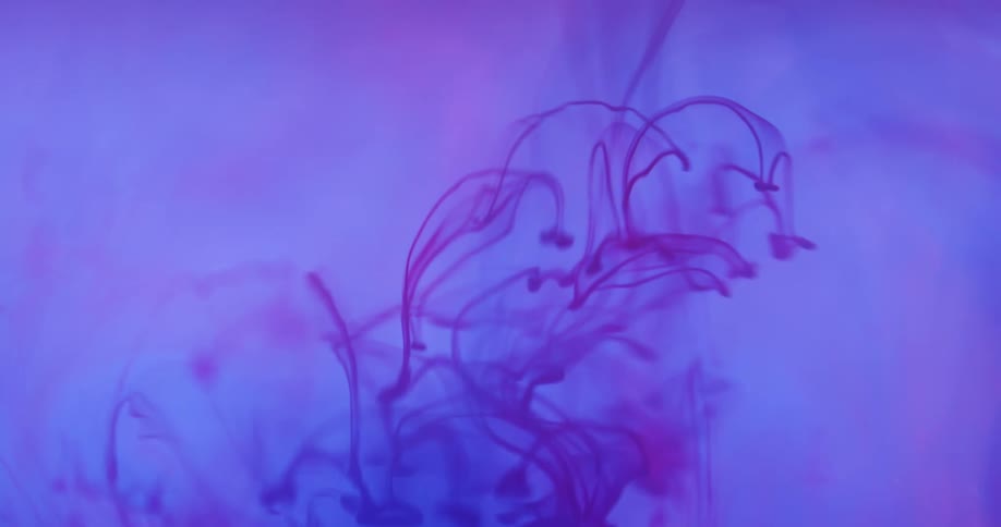Colored ink swirls in a medium